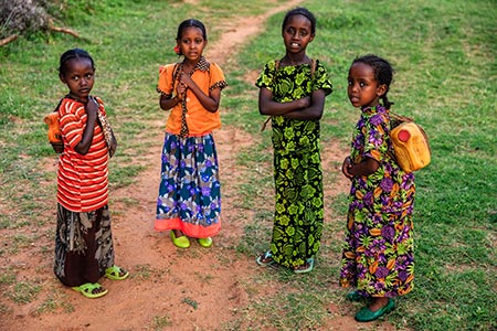 Ethiopian girls carrying water from the well